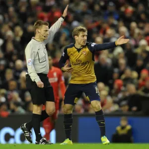 Nacho Monreal Argues with Referee during Intense Liverpool vs. Arsenal Premier League Clash (2015-16) Nacho Monreal Argues with Referee during Intense Liverpool vs. Arsenal Premier League Clash (2015-16)