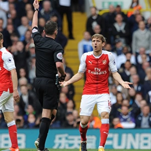 Nacho Monreal Shown Yellow Card by Referee Michael Oliver in Tottenham Hotspur vs Arsenal Premier League Clash