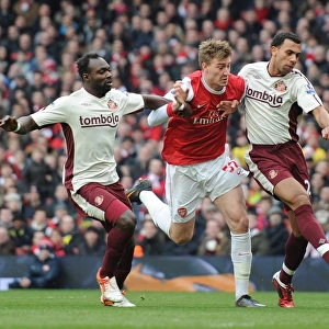 Nicklas Bendtner (Arsenal) John Mensah and Anton Ferdinand (Sunderland)