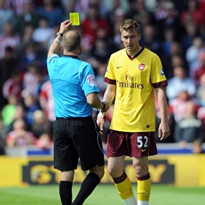 Nicklas Bendtner (Arsenal) is shown the yellow card. Stoke City 3: 1 Arsenal