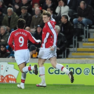 Nicklas Bendtner celebrates scoring the 2nd Arsenal goal with Eduardo. Hull City 1