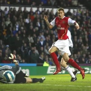 Nicklas Bendtner shoots past Derby goalkeeper Roy Carroll to score the 1st Arsenal goal