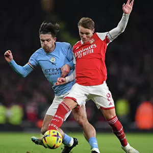 Odegaard Outmuscles Grealish: Arsenal's Midfield Maestro Wins Battle Against Manchester City Star