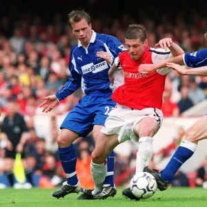 Oleg Luzhny (Arsenal) Mark Pembridge and Tobias Linderoth (Everton) Oleg Luzhny (Arsenal) Mark Pembridge and Tobias Linderoth (Everton)
