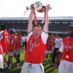 Oleg Luzhny with the F. A. Barclaycard Premiership Trophy