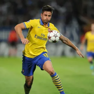 Olivier Giroud in Action: Arsenal vs. Marseille, UEFA Champions League (2013) Olivier Giroud in Action: Arsenal vs. Marseille, UEFA Champions League (2013)