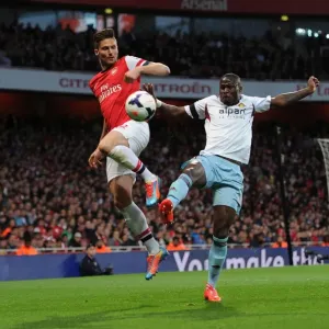 Olivier Giroud (Arsenal) Guy Demel (West Ham). Arsenal 3: 1 West Ham United. Barclays Premier League Olivier Giroud (Arsenal) Guy Demel (West Ham). Arsenal 3: 1 West Ham United. Barclays Premier League