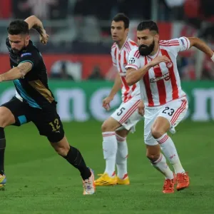 Olivier Giroud Overpowers Dimitris Siovas: Arsenal's Thrilling Victory over Olympiacos in the UEFA Champions League, Athens 2015 Olivier Giroud Overpowers Dimitris Siovas: Arsenal's Thrilling Victory over Olympiacos in the UEFA Champions League, Athens 2015