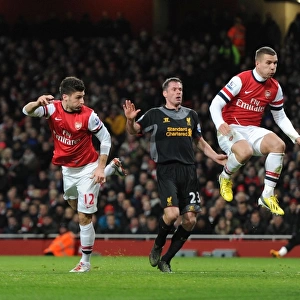 Olivier Giroud scores Arsenal 1st goal as he gets ahead of Jamie Carragher (Liverpool)