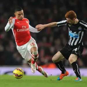 Oxlade-Chamberlain vs Colback: A Football Battle in the Arsenal vs Newcastle United Premier League Clash (December 2014) Oxlade-Chamberlain vs Colback: A Football Battle in the Arsenal vs Newcastle United Premier League Clash (December 2014)