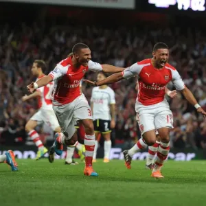 Oxlade-Chamberlain's Last-Minute Thriller: Arsenal Edges Past Tottenham in Intense 2014-15 Premier League Clash