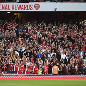 Passionate Arsenal Fans at Emirates Stadium: Arsenal vs. Tottenham in the Premier League (2021-22)