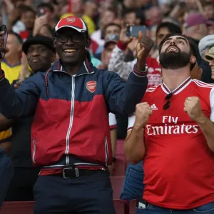 Passionate Arsenal Fans at Emirates Stadium: Arsenal vs. Tottenham, Premier League 2021-22 Passionate Arsenal Fans at Emirates Stadium: Arsenal vs. Tottenham, Premier League 2021-22