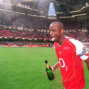 Patrick Vieira (Arsenal) celebrates with some Champagne after the match
