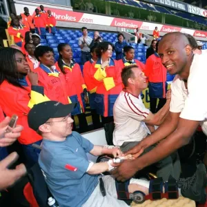 Patrick Vieira celebrates at the end of the match with a disabled fan Patrick Vieira celebrates at the end of the match with a disabled fan