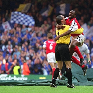 Patrick Vieira and David Seaman celebrate after the final whistle