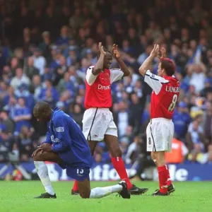 Patrick Vieira and Fredrik Ljungberg celebrate the Arsenal victory as dejected Chelsea defender Will Patrick Vieira and Fredrik Ljungberg celebrate the Arsenal victory as dejected Chelsea defender Will
