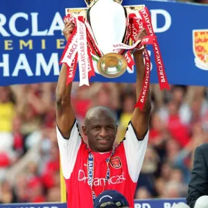 Patrick Vieira lifts the Premiership trophy after the match Patrick Vieira lifts the Premiership trophy after the match