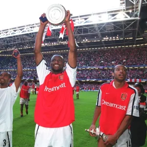 Patrick Vieira, Thierry Henry and Ashley Cole celebrate after the match