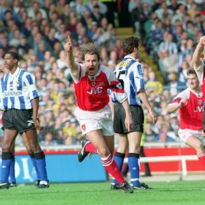 Paul Merson celebrates scoring a goal for Arsenal