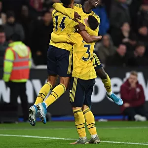 Pepe, Aubameyang, and Martinelli Celebrate Arsenal's Winning Goals Against West Ham United (December 2019)