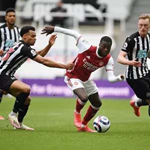 Pepe Faces Off Against Murphy and Longstaff: Newcastle vs. Arsenal in Empty St. James Park (2020-21)