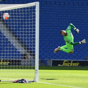 Pepe Scores in Empty Stadium: Arsenal Wins Against Brighton Amidst Pandemic-Enforced Silence