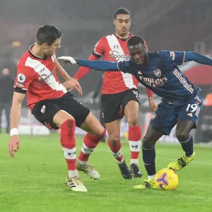Pepe vs Bednarek: Empty St Mary's Showdown - Arsenal's Nicolas Pepe Clashes with Southampton's Jan Bednarek in Premier League's Empty Stadiums (2021)