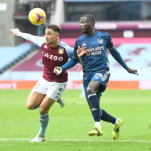 Pepe vs. Cash: Premier League Rivalry at Empty Villa Park Amidst COVID-19 Restrictions - Arsenal vs. Aston Villa (February 2021)