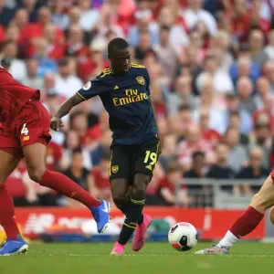 Pepe vs. Van Dijk: A Premier League Showdown - Liverpool vs. Arsenal, 2019-20 Pepe vs. Van Dijk: A Premier League Showdown - Liverpool vs. Arsenal, 2019-20