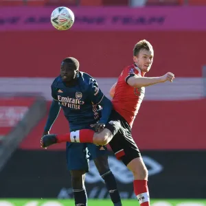 Pepe vs Ward-Prowse: FA Cup Clash Between Southampton and Arsenal Amidst Empty Stands Pepe vs Ward-Prowse: FA Cup Clash Between Southampton and Arsenal Amidst Empty Stands