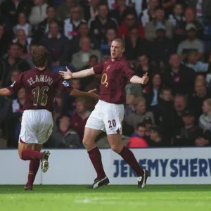 Philippe Senderos celebrates scoring a goal for Arsenal with Mathieu Flamini