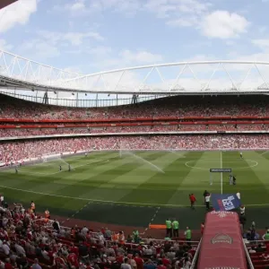 The pitch is watered before the match