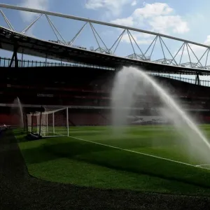The pitch is watered before the match. Arsenal 4: 0 Watford. Barclays Premier League The pitch is watered before the match. Arsenal 4: 0 Watford. Barclays Premier League