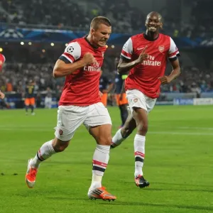 Podolski and Diaby Celebrate Arsenal's First Goal vs Montpellier (2012-13 Champions League) Podolski and Diaby Celebrate Arsenal's First Goal vs Montpellier (2012-13 Champions League)