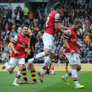 Podolski, Giroud, and Ramsey Celebrate Arsenal's Victory over Hull City