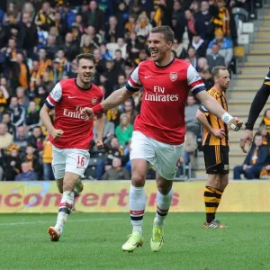 Podolski and Ramsey Celebrate Arsenal's Victory: Hull City vs Arsenal, Premier League 2013/14