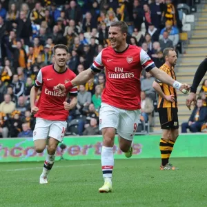 Podolski and Ramsey's Epic Goal Celebration: Arsenal's Unforgettable Win Against Hull City (2014)