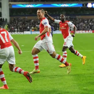 Podolski Scores Arsenal's Second Goal in Champions League Clash against RSC Anderlecht