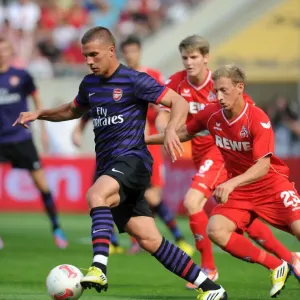 Podolski vs. Royer: Clash of the Forwards in Arsenal's Pre-Season Friendly against Cologne (2012)