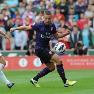 Podolski vs. Wilkinson: Battle at Britannia Stadium - Stoke City vs. Arsenal, 2012-13 Premier League Podolski vs. Wilkinson: Battle at Britannia Stadium - Stoke City vs. Arsenal, 2012-13 Premier League
