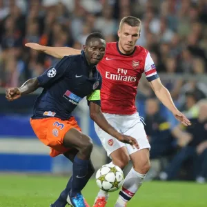 Podolski vs Yanga-Mbiwa: A Champions League Battle Podolski vs Yanga-Mbiwa: A Champions League Battle