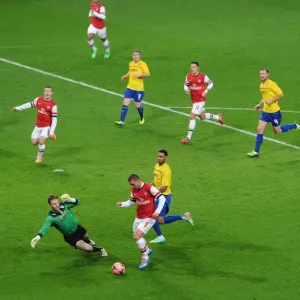 Podolski's Dramatic FA Cup Goal: Outmaneuvering Murphy for Arsenal's Victory over Coventry City Podolski's Dramatic FA Cup Goal: Outmaneuvering Murphy for Arsenal's Victory over Coventry City