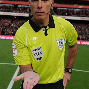 Premier League Showdown: Arsenal vs. Everton - Referee Howard Webb Conducts Coin Toss at Emirates Stadium (December 2011)