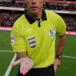 Premier League Showdown: Arsenal vs. Everton - Referee Howard Webb Conducts Coin Toss at Emirates Stadium (December 2011)