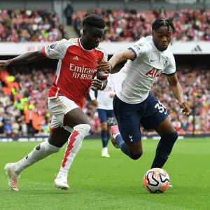Print of Bukayo Saka vs. Destiny Udogie at Emirates Stadium