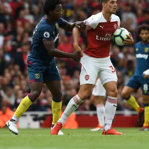 Print of Granit Xhaka and Carlos Sanchez in action Print of Granit Xhaka and Carlos Sanchez in action