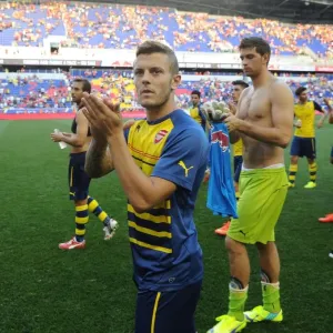 Print of Jack Wilshere applauding fans after a 2014 pre-season match Print of Jack Wilshere applauding fans after a 2014 pre-season match