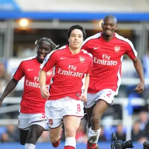 Print of Nasri, Sagna, Diaby celebrating a goal Print of Nasri, Sagna, Diaby celebrating a goal