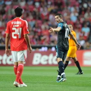 Print of Robin van Persie facing Garay in a pre-season friendly match Print of Robin van Persie facing Garay in a pre-season friendly match